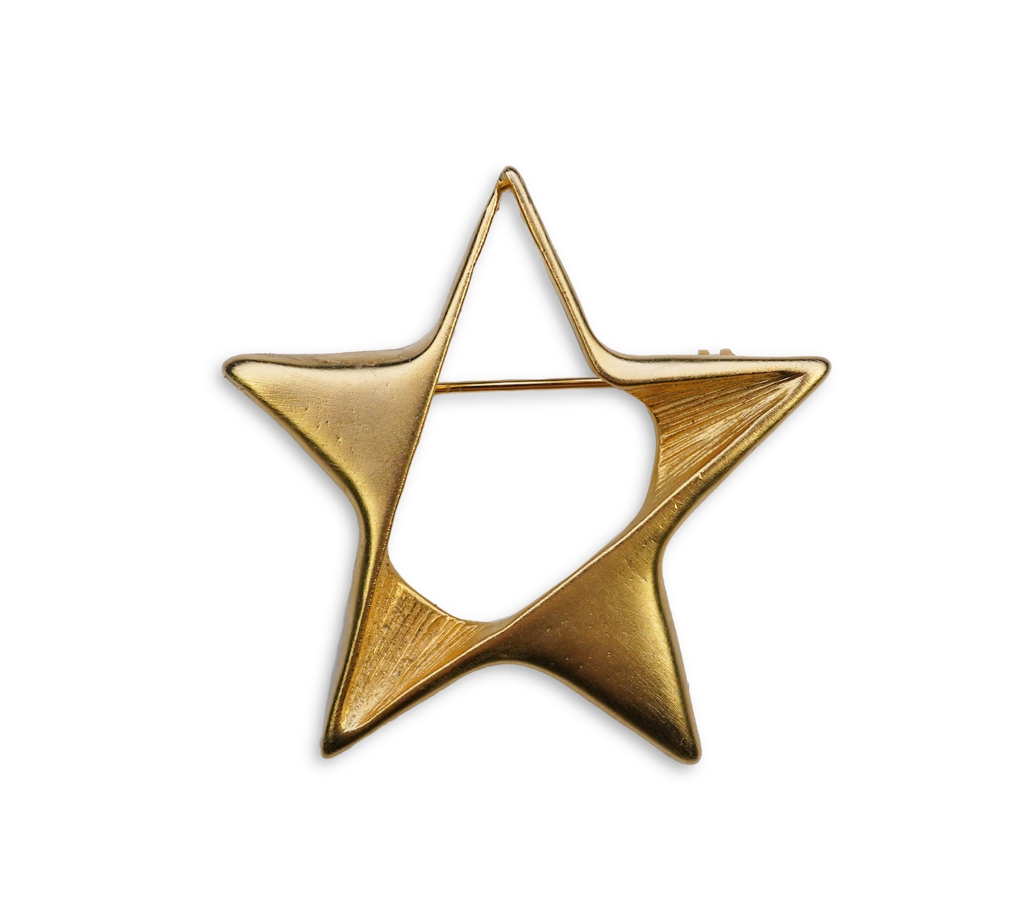 A tarnished gold star brooch in box